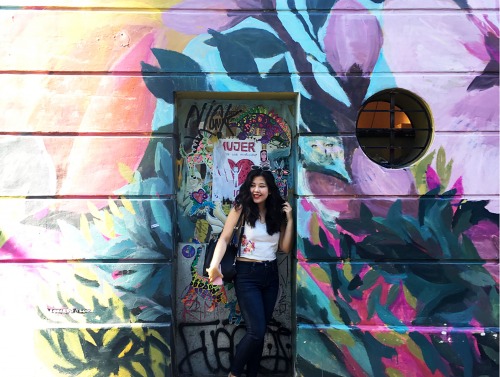 Student in front of graffiti in Buenos Aires