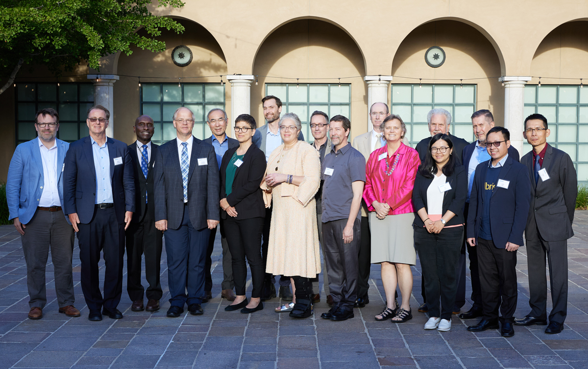 Educational leaders representing six of the nine members of the Pacific Alliance of Liberal Arts College pose in front of the Athenaeum