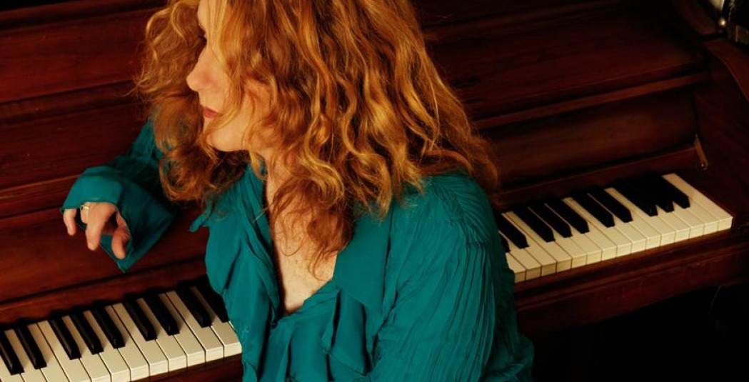 Teresa James sitting at a piano