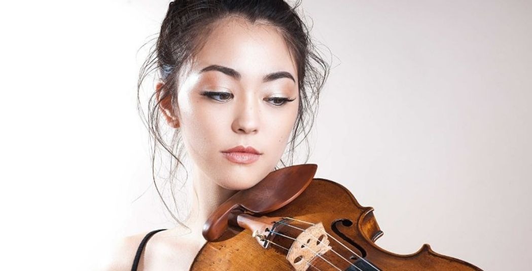 Simone Porter holding a violin