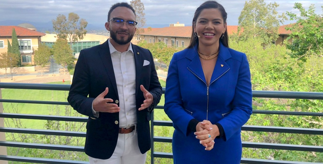 Celebration hosts with campus backdrop