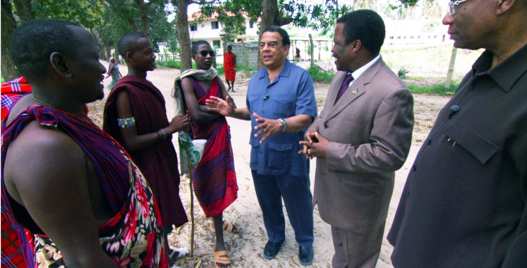 Andrew Young speaks with a group of people in Africa