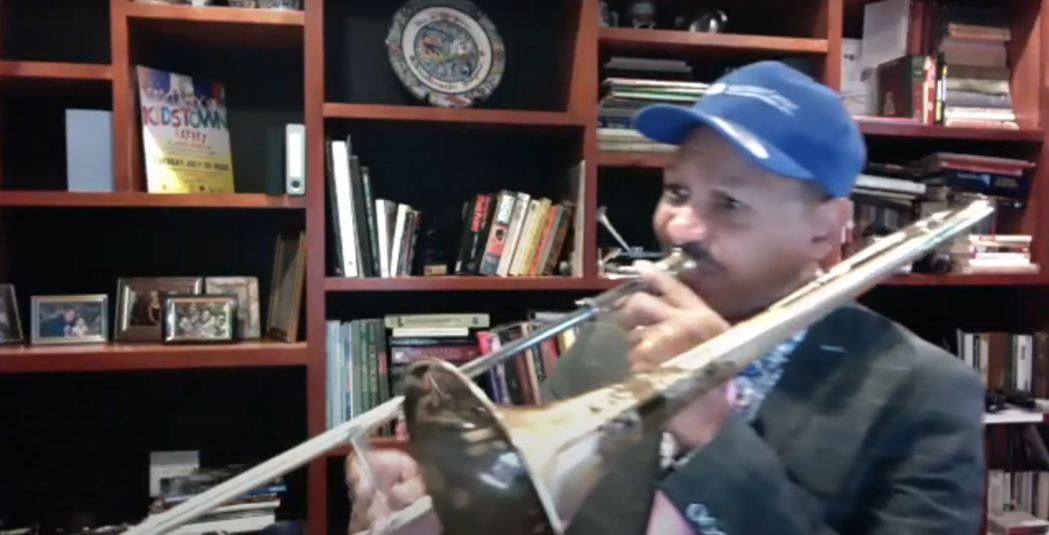 Master trombonist, Delfeayo Marsalis, plays the trombone on a Zoom call