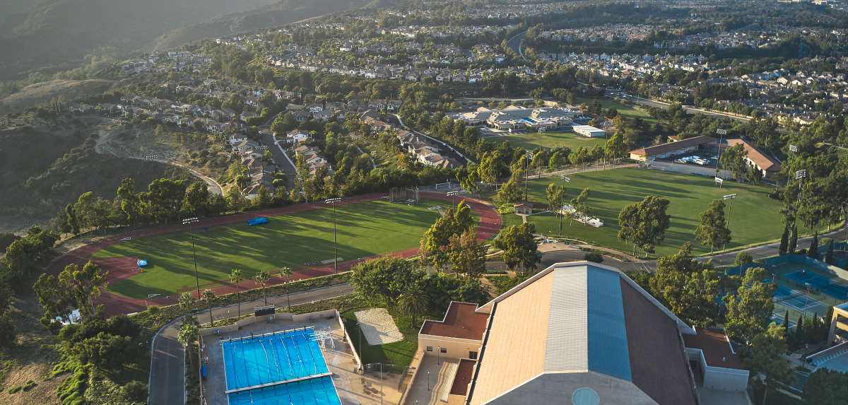  Aerial shot of pool, recreation center, and athletic facilities on SUA's campus.
