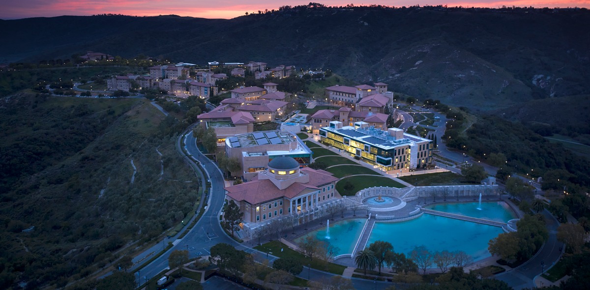 Aerial Drone image of Soka University of America's campus during sunset with a pink and purple sky