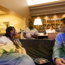 Students sit on couches and discuss “Citizen King,” a documentary examining the final years of Dr. King’s life