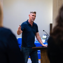 SUA adjunct instructor of photography Joaquín Palting speaks to the gallery opening attendees.