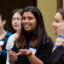 College Night attendees smile and talk amongst eachother