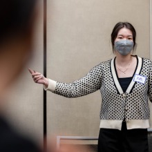 A College Night presenter gestures during her presentation