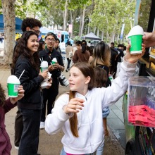 People get shave ice from a food truck during the 2025 Homecoming event