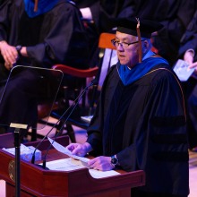SUA President Ed Feasel speaks to the graduates and their families during commencement.