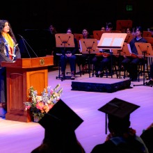 A student speaker addresses the crowd during commencement.
