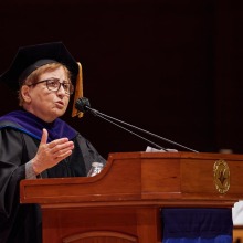 Commencement Keynote Speaker, Dr. Shirin Ebadi, speaks at the lectern