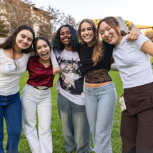 Five women pose for a photo during the welcome back event.