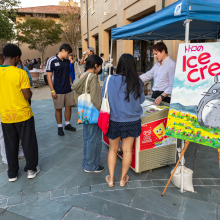 Dave Welch hands out ice cream to students during the welcome back event.