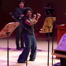 Jucimara Colombo, mother of Lucas, dances passionately on stage during the memorial service.