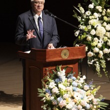 SUA President Ed Feasel speaks during the memorial service.