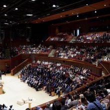 Aerial view of President Feasel addressing graduates and their families at the 2022 Commencement Ceremony