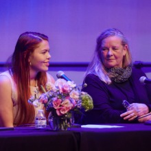 Anne Pearce, director of the creative arts program, Soka alumnus Giselle Velasquez ’15 sit on stage