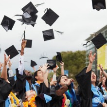 The Class of 2023 throw their graduation caps in the air in celebration!