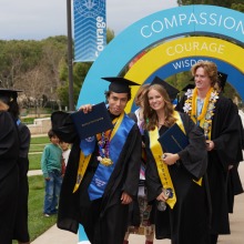 Graduates walk out of commencement after the ceremony.