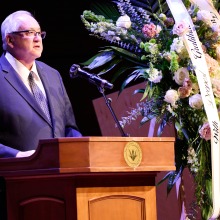 President Ed Feasel addresses the attendees during the service