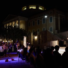 A student speaks to the crowd during the candlelit vigil for Daisaku Ikeda
