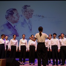 Soka students perform a song in honor or Daisaku Ikeda