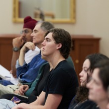 Symposium participants listen intently during the presentations