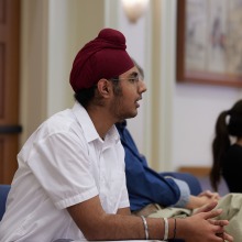 A participant listens intently during the symposium