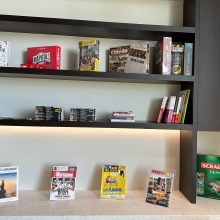 A bookshelf with various magazines