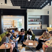 A large group of students sits together in the Global Language and Culture Center