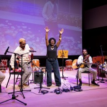 Jucimara Colombo, mother of Lucas, performs a song during the memorial service.