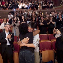Lucas' mom and Jun Sawada '26 share an emotional hug in front of the crowd during the memorial service.
