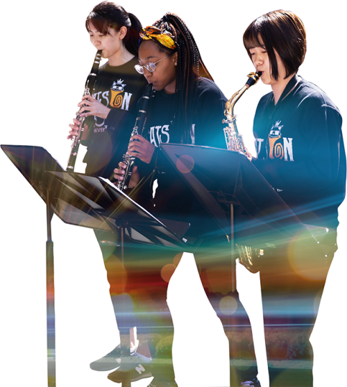 Three students play wind instruments