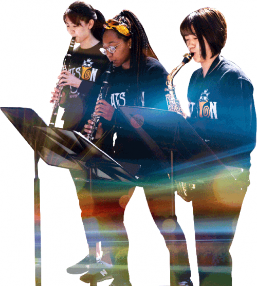 Three students play wind instruments