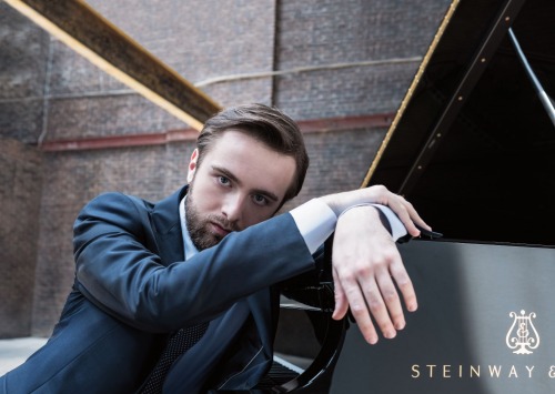 Daniil Trifonov sitting at piano