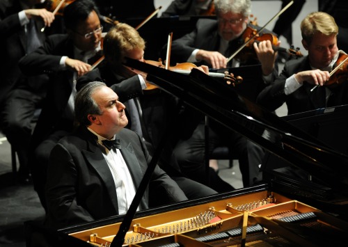 Yefim Bronfman sitting at piano at concert