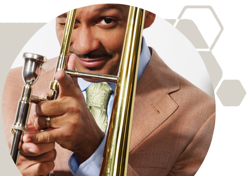 Man in brown suit holding a trumpet
