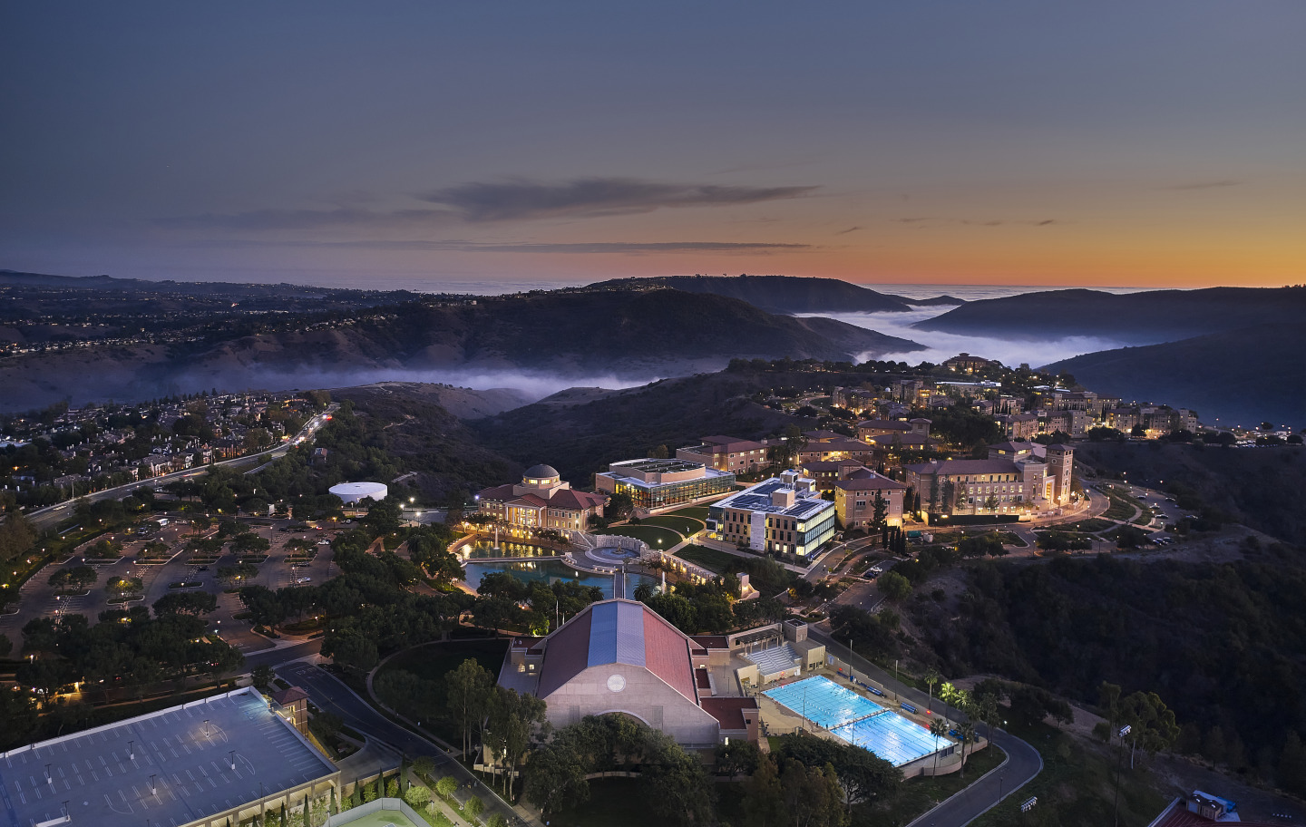 Aerial drone shot of SUA's campus during dusk