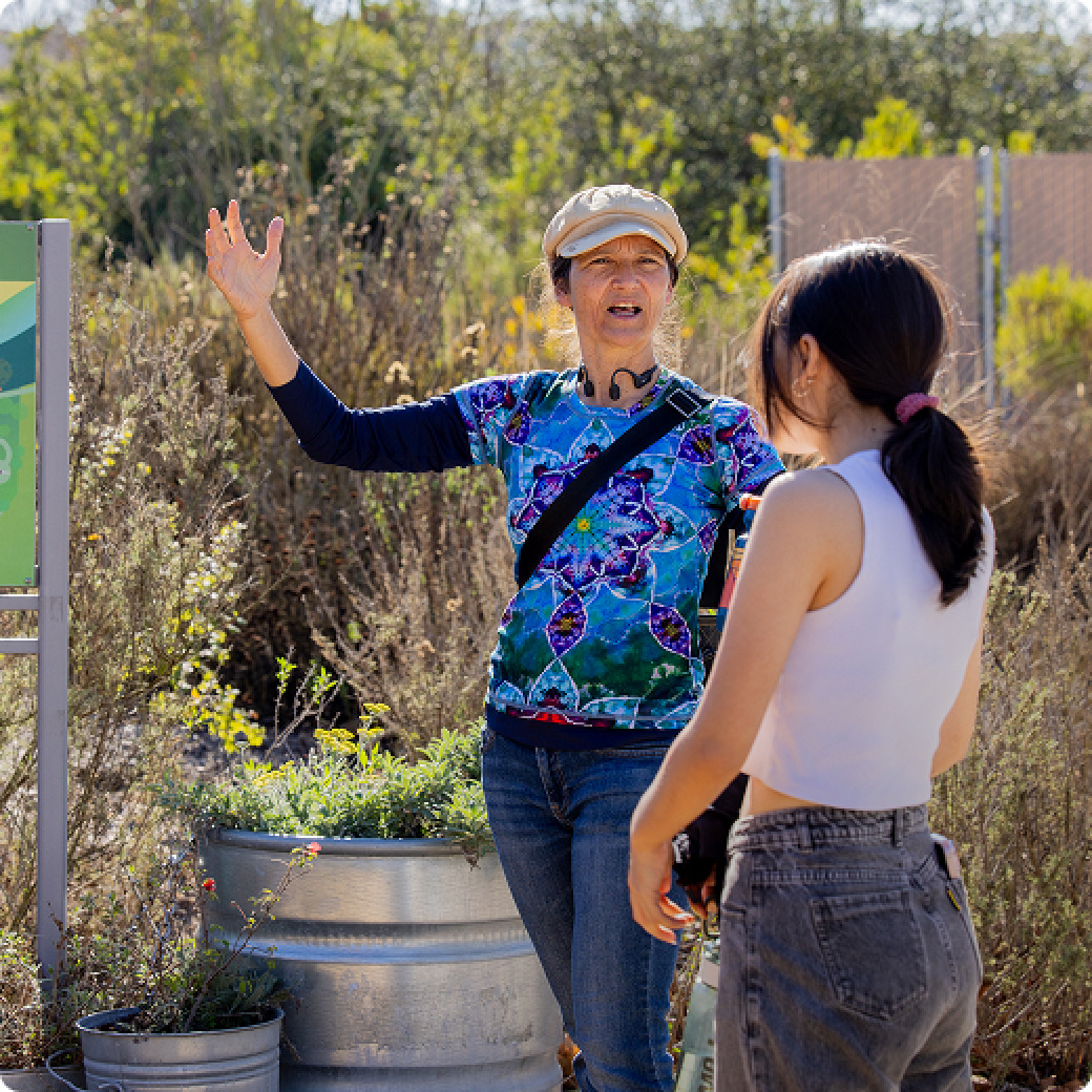 Teacher instructing student in the field