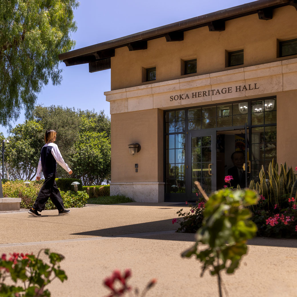 A student walks into Heritage Hall on campus.