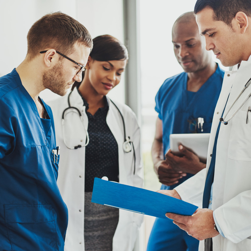 A medical team collaborating and reviewing documents together