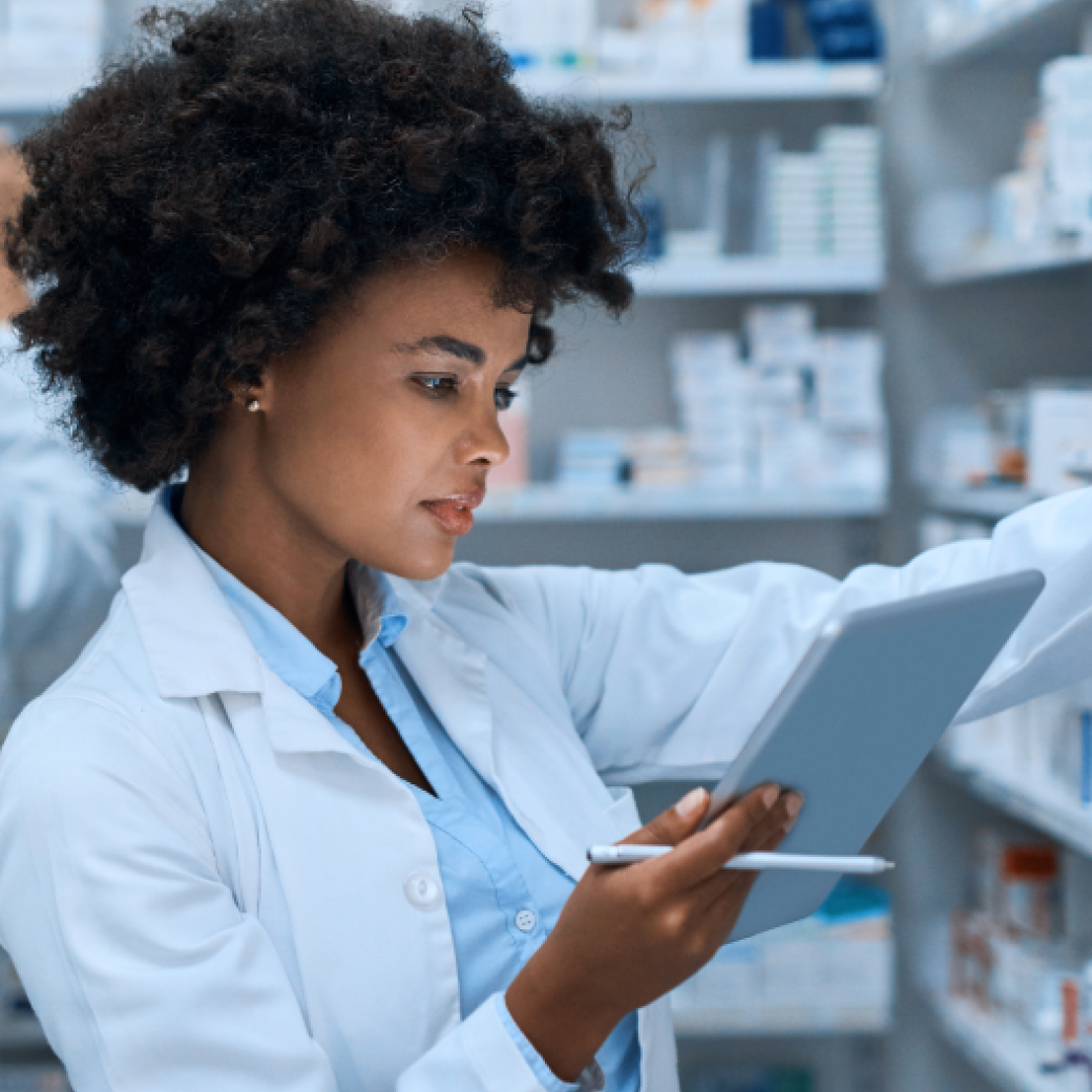Pharmacist conducting inventory and organizing medication stock