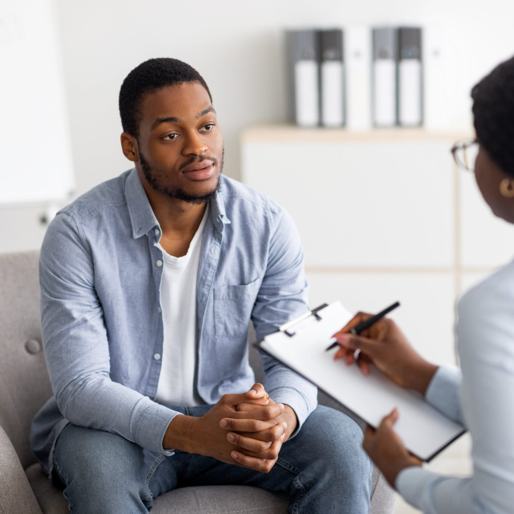 A man consulting a genetic counselor