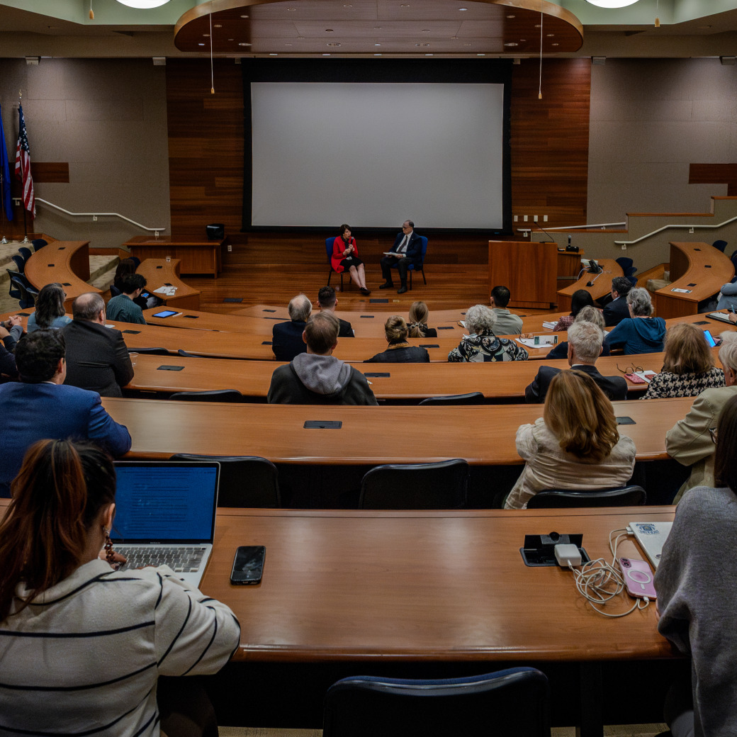 Many people attending a PBRC meeting in a large conference room