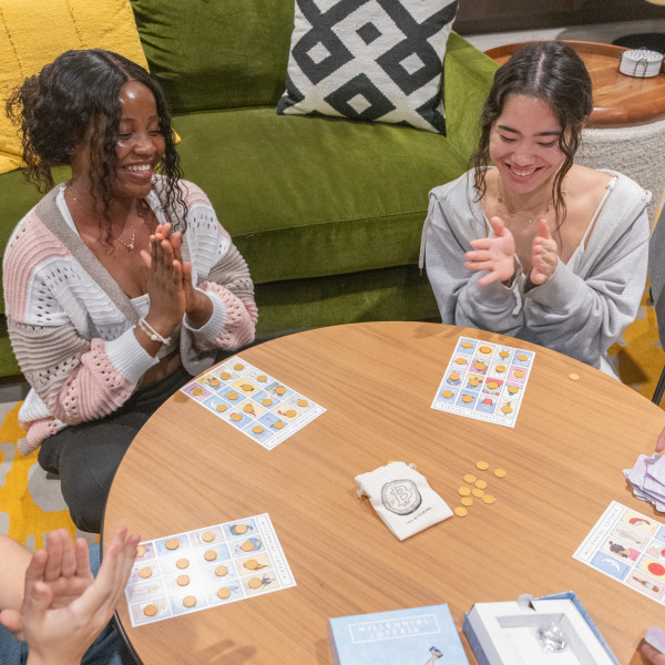 Students participate in a board game during a tutoring session.