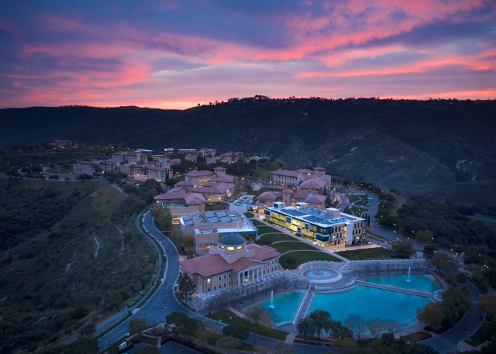 Aerial Drone image of Soka University of America's campus during sunset with a pink and purple sky