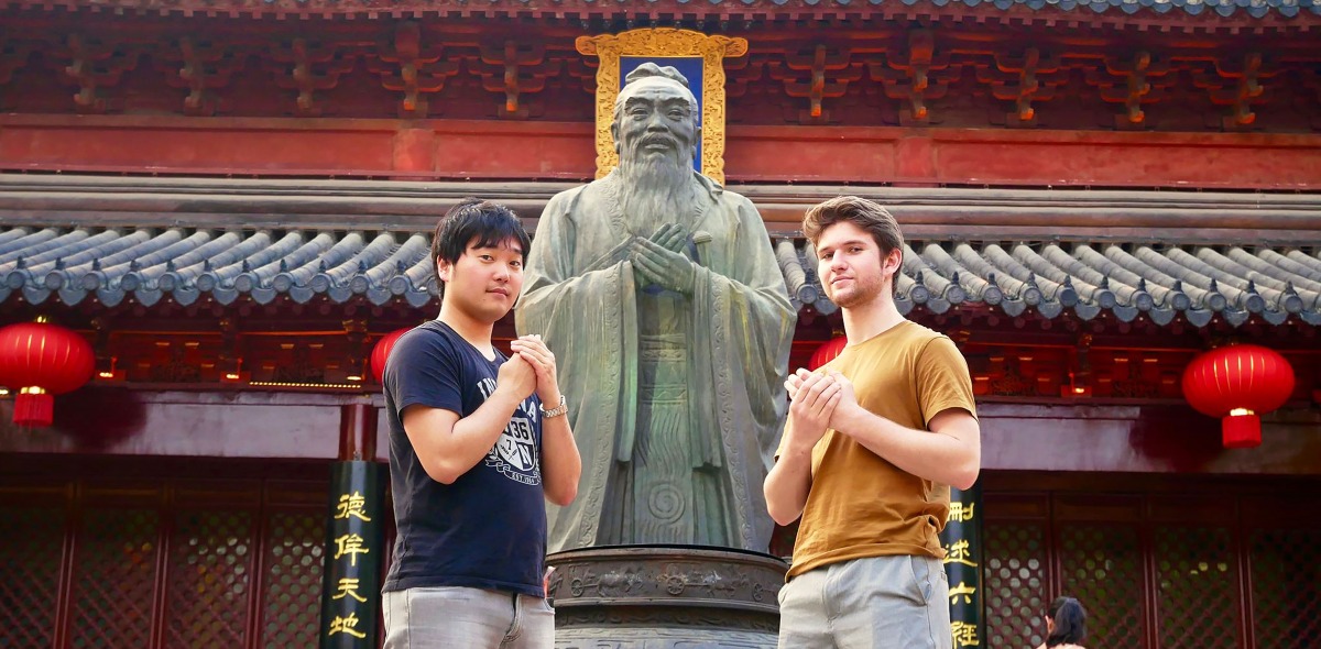 Two students with statue in Shanghai