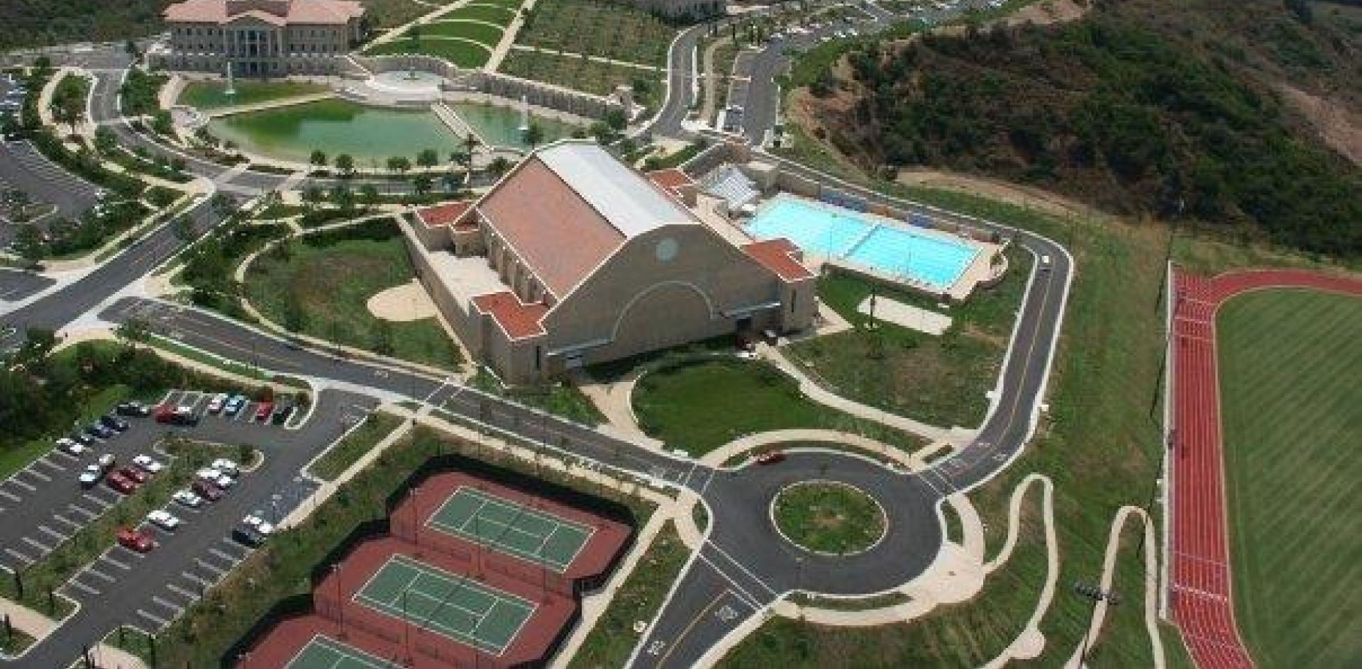 Aerial image of the Recreation Center, pool, tennis courts, and track.